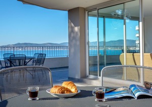 Oceanview Gem: 2BR Apt with Terrace, Beach & City Center Access