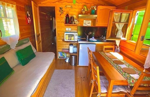 Cublac Ski Chalet | A wooden caravan at Domaine de la Morétie