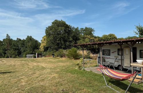 Champsac RV Rental | Caravan 'Vue Sur L'étang' with Lake View, Shared Pool and Private Terrace