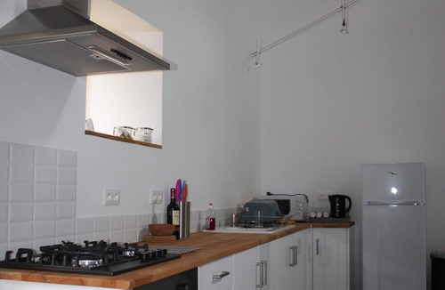 Soumeras House | Spacious, double height, beamed main space. This gite is in a rural setting.