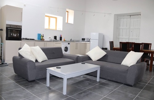 Soumeras House | Spacious, double height, beamed main space. This gite is in a rural setting.