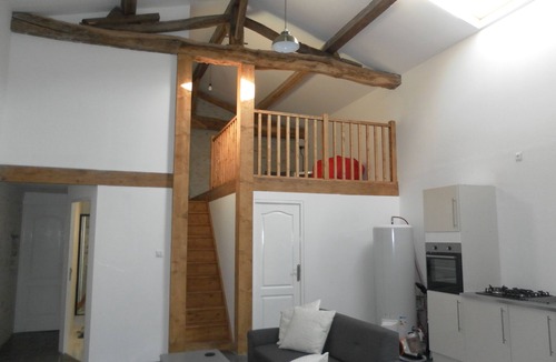 Soumeras House | Spacious, double height, beamed main space. This gite is in a rural setting.